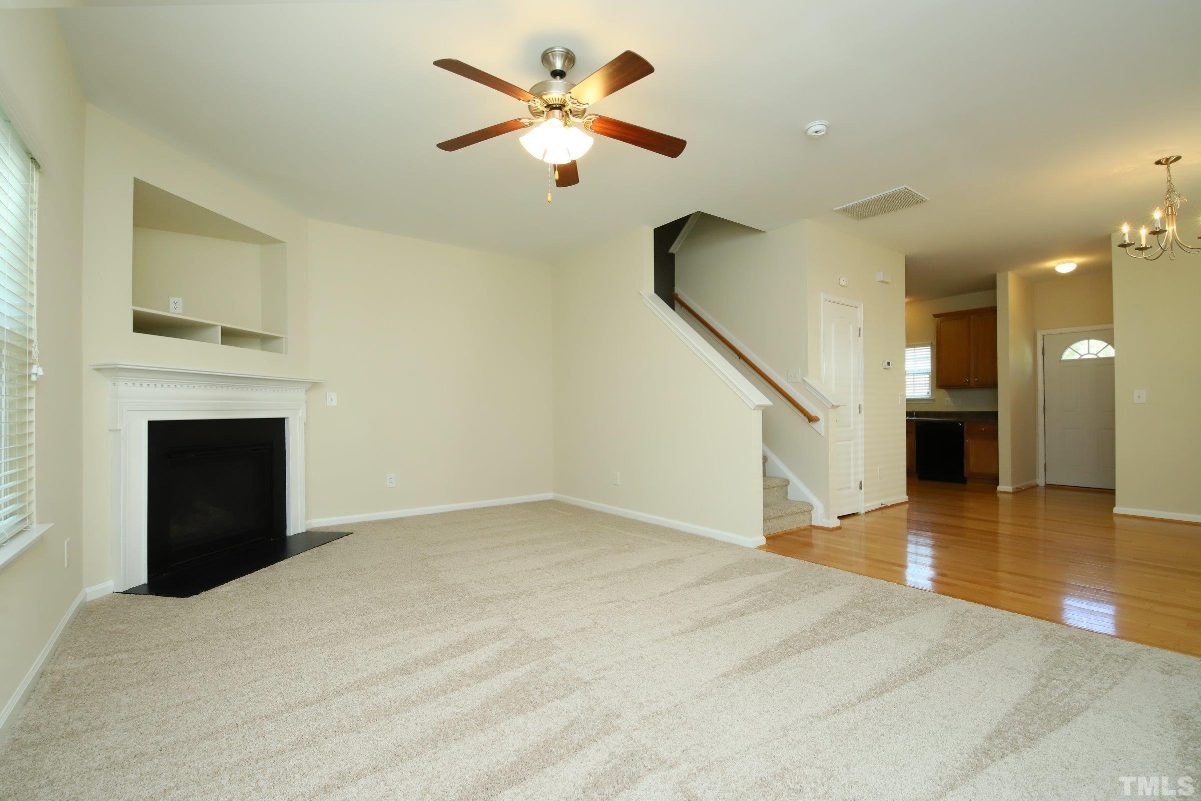 3118 Binghampton Lane Raleigh, NC 27604 - Photo 4 of 27 a view of an empty room with a fireplace