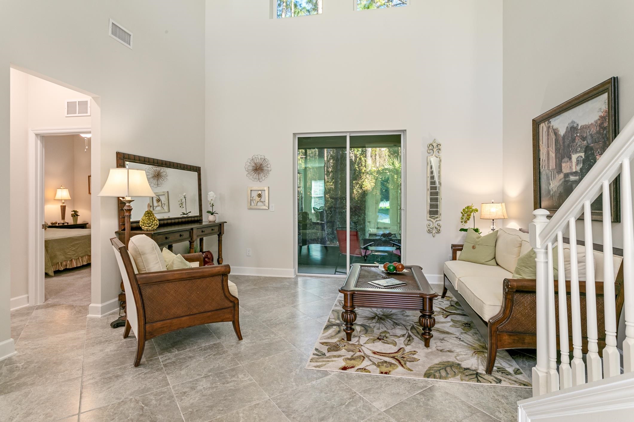 264 Grand Ravine Drive St. Augustine, FL 32086 - Photo 17 of 46 a living room with furniture and a flat screen tv