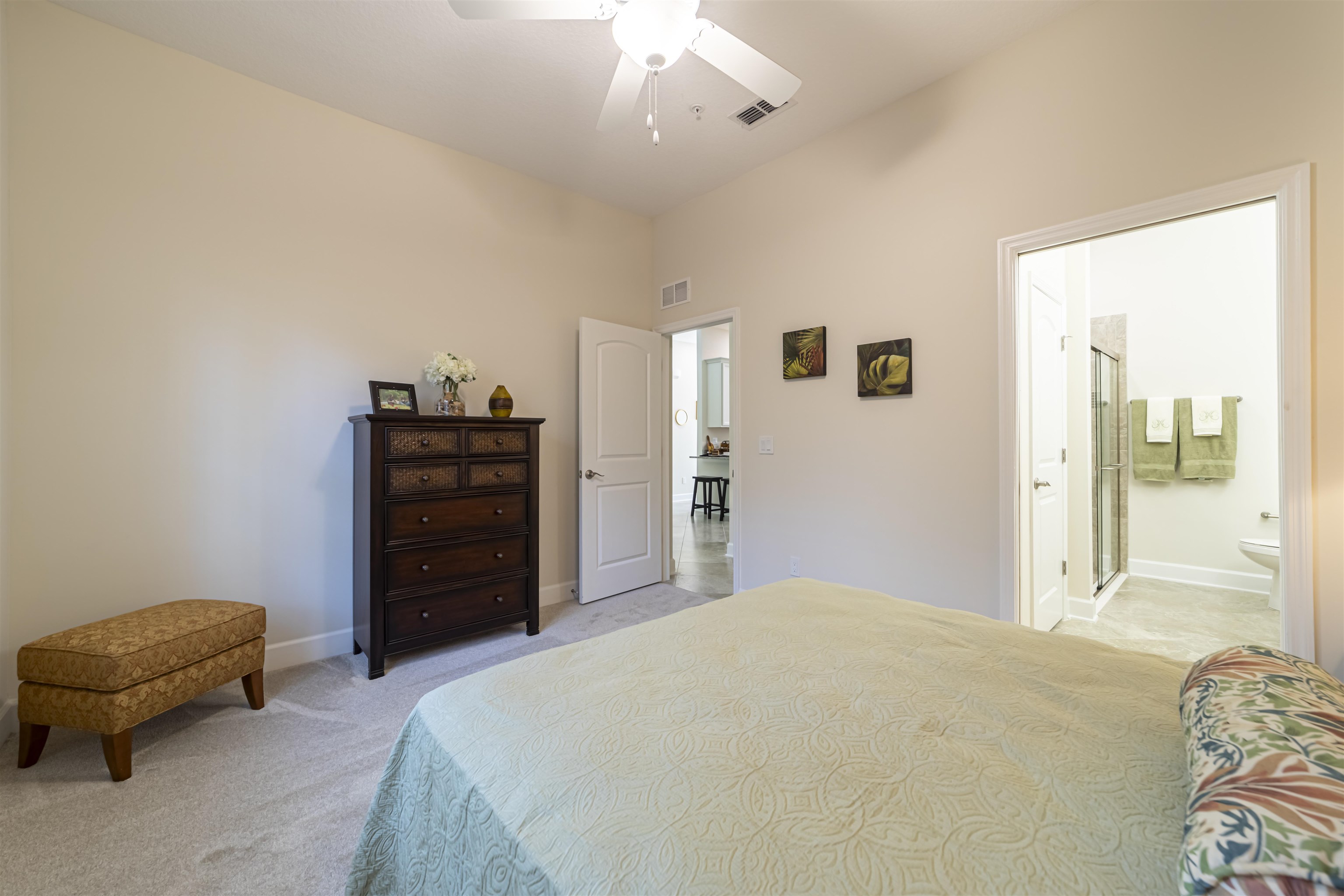 264 Grand Ravine Drive St. Augustine, FL 32086 - Photo 21 of 46 a bedroom with a bed and a couch