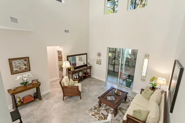 a view of a big room with closet and windows