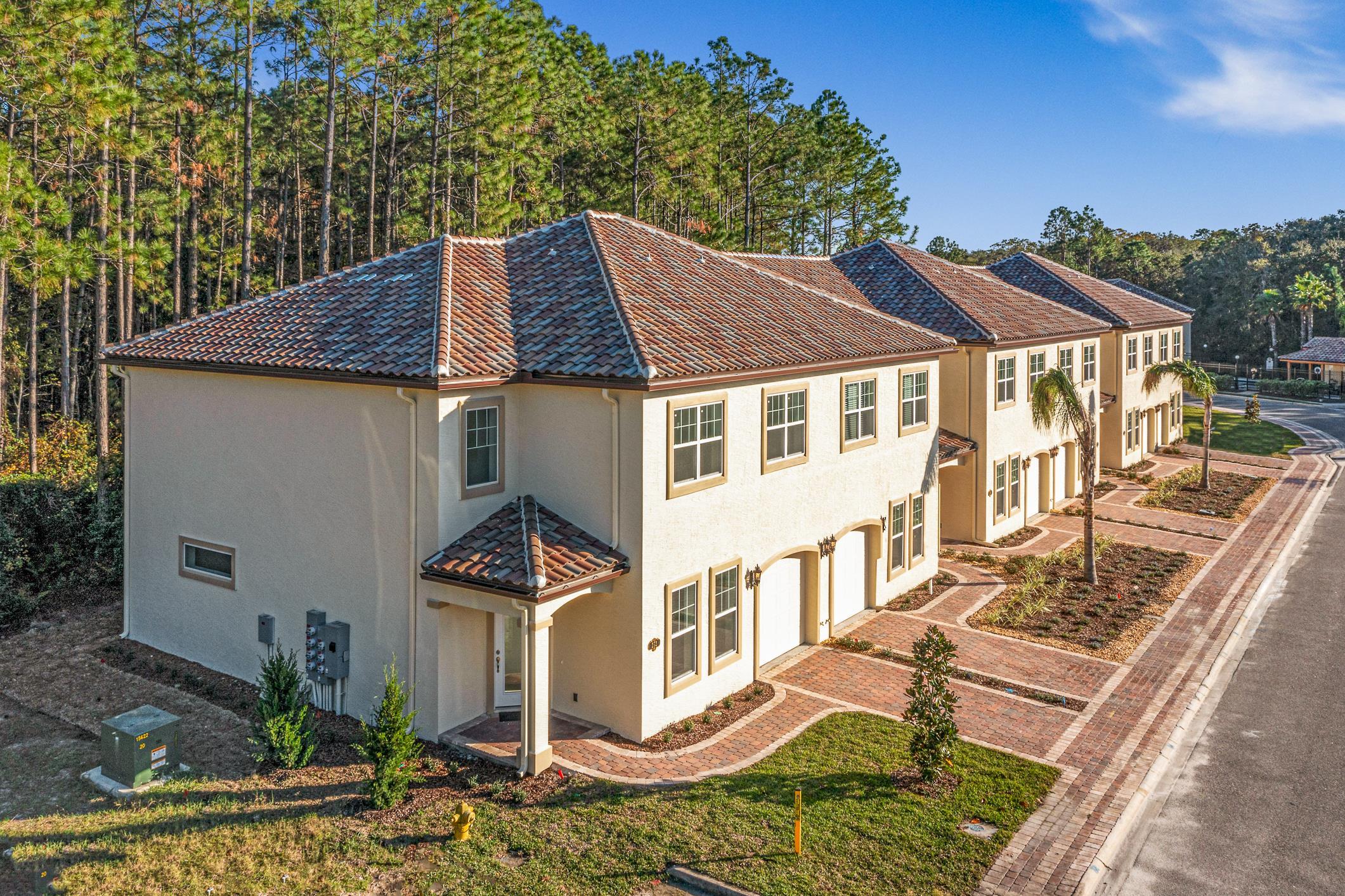 264 Grand Ravine Drive St. Augustine, FL 32086 - Photo 5 of 46 a front view of a house with garden