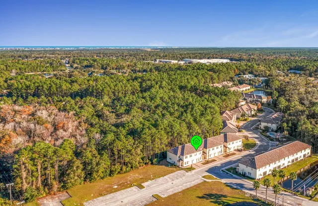 a view of a large building with a yard