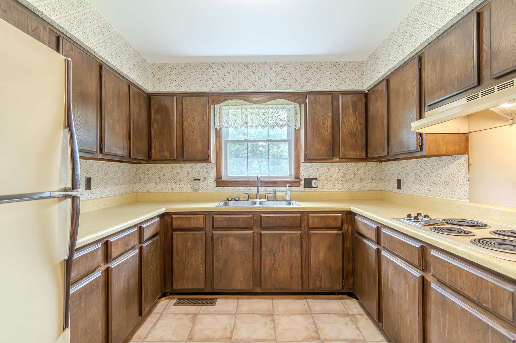 2737 Fly Road Santa Fe, TN 38482 - Photo 11 of 44 a kitchen with a sink stove and cabinets