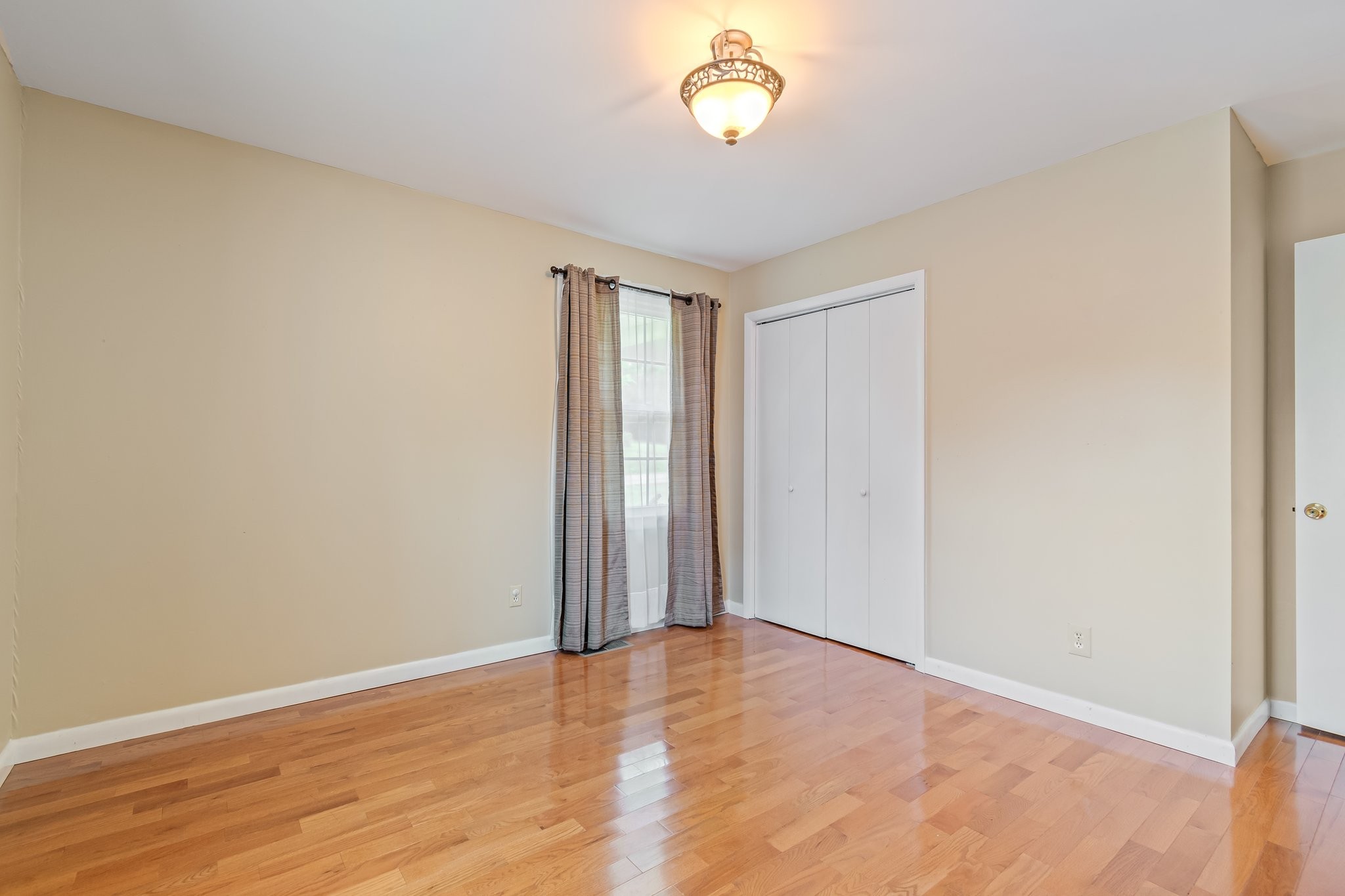 2737 Fly Road Santa Fe, TN 38482 - Photo 23 of 44 an empty room with wooden floor and windows