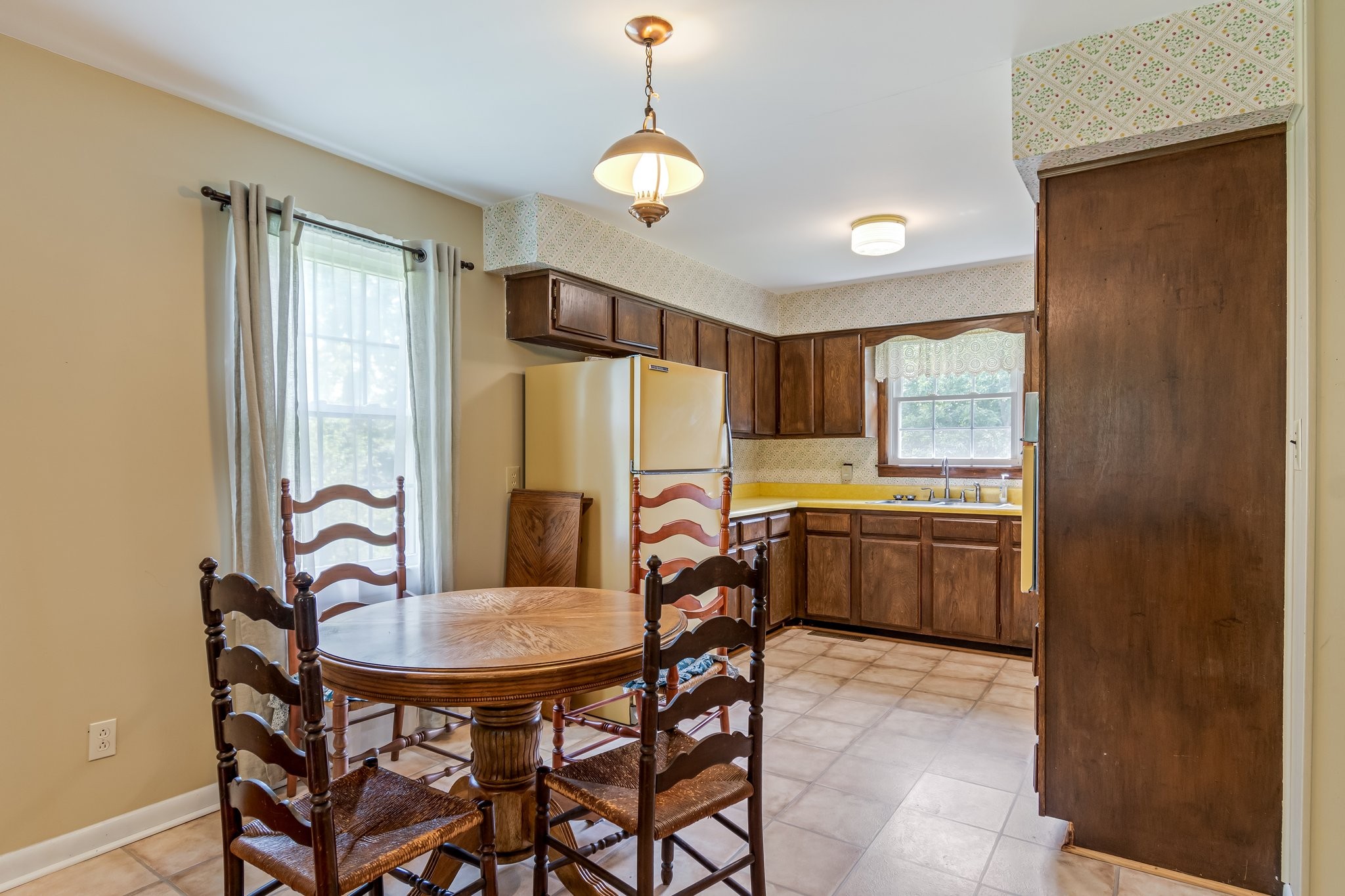 2737 Fly Road Santa Fe, TN 38482 - Photo 8 of 44 a kitchen with a table and chairs