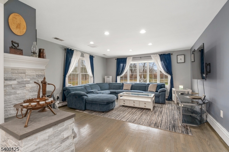 18 Old Wolfe Road Budd Lake, NJ 07828 - Photo 14 of 49 a living room with furniture and a flat screen tv