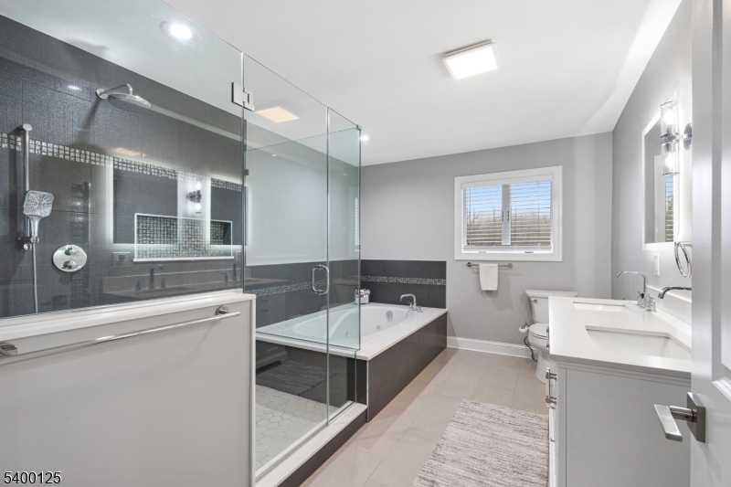 18 Old Wolfe Road Budd Lake, NJ 07828 - Photo 16 of 49 a bathroom with a tub sink and mirror