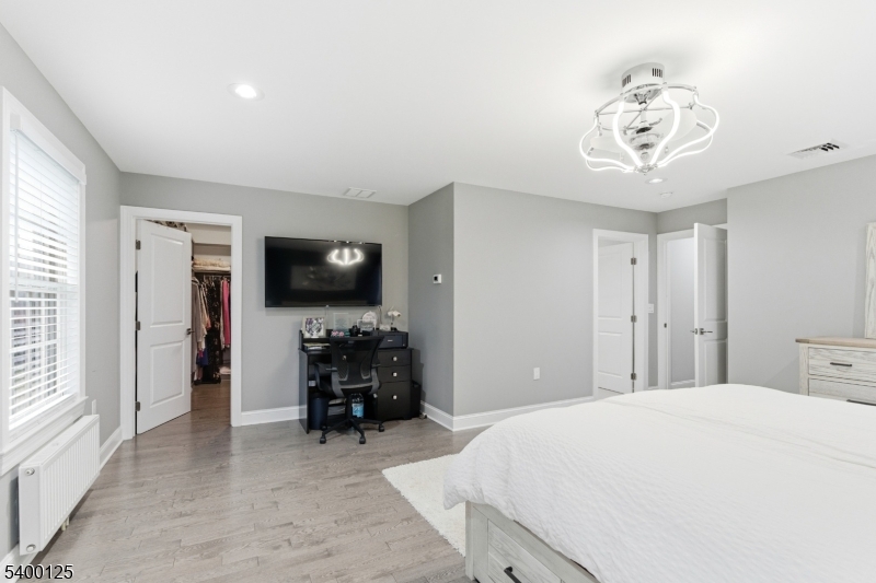 18 Old Wolfe Road Budd Lake, NJ 07828 - Photo 17 of 49 a bedroom with a bed and a television in it
