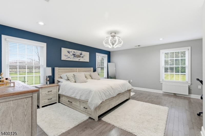 18 Old Wolfe Road Budd Lake, NJ 07828 - Photo 18 of 49 a spacious bedroom with a large bed and a window