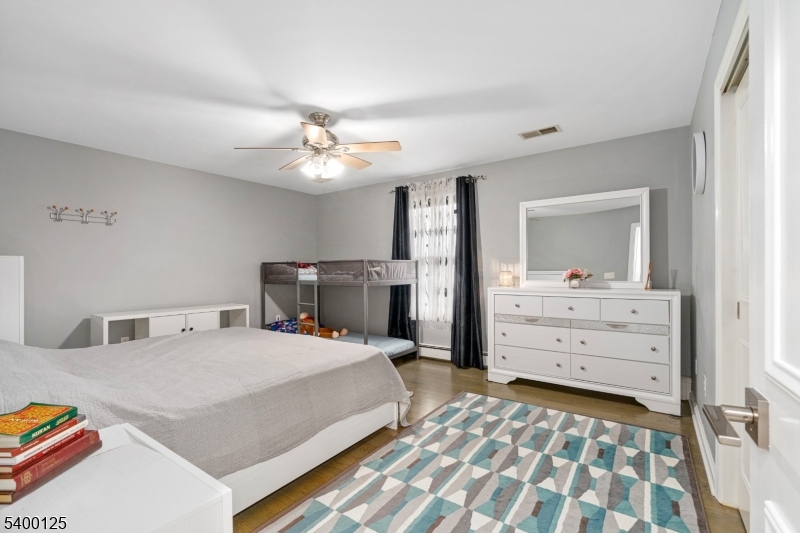 18 Old Wolfe Road Budd Lake, NJ 07828 - Photo 19 of 49 a bedroom with a bed and a dresser