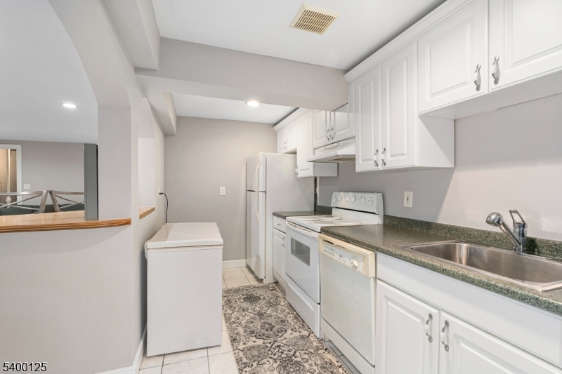 18 Old Wolfe Road Budd Lake, NJ 07828 - Photo 27 of 49 a kitchen with a sink stove and cabinets
