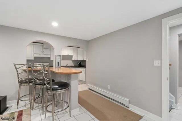 a kitchen with a sink cabinets and window