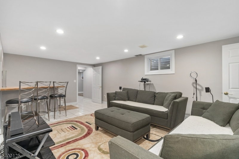 18 Old Wolfe Road Budd Lake, NJ 07828 - Photo 30 of 49 a living room with furniture and a view of kitchen