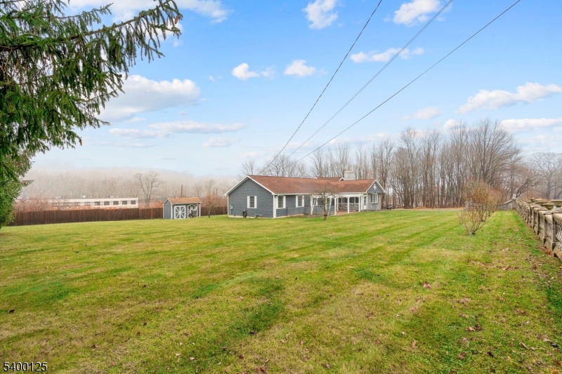 18 Old Wolfe Road Budd Lake, NJ 07828 - Photo 38 of 49 a view of a big house with a big yard and palm trees
