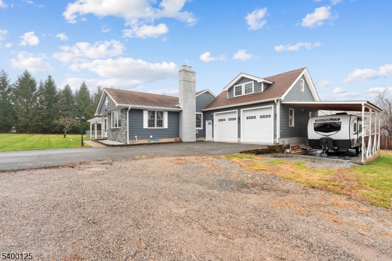 18 Old Wolfe Road Budd Lake, NJ 07828 - Photo 44 of 49 a front view of a house with a yard and garage