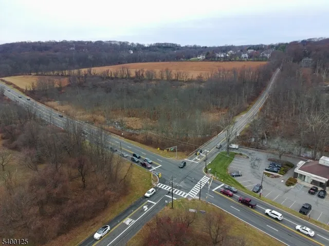 an aerial view of a house with a lake view