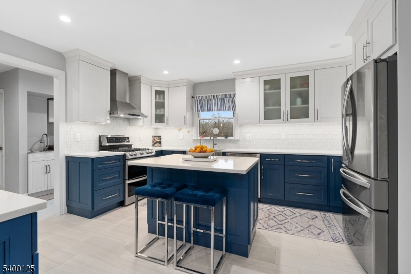 18 Old Wolfe Road Budd Lake, NJ 07828 - Photo 6 of 49 a kitchen with stainless steel appliances granite countertop a refrigerator a sink dishwasher a stove with wooden cabinets and floor