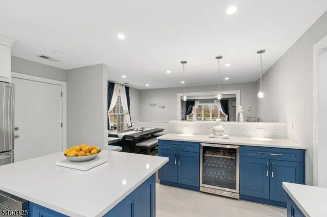 a kitchen with a sink a stove and a refrigerator