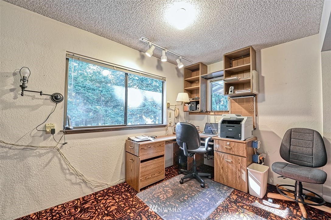 963 West Larson Road Bellingham, WA 98226 - Photo 22 of 40 a view of a workspace with furniture and a window