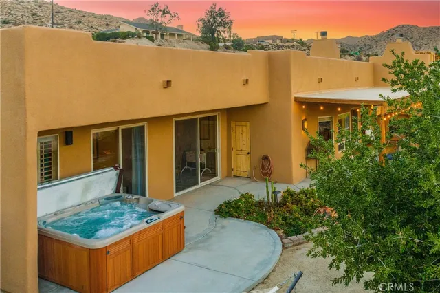 aerial view of a house with pool and yard