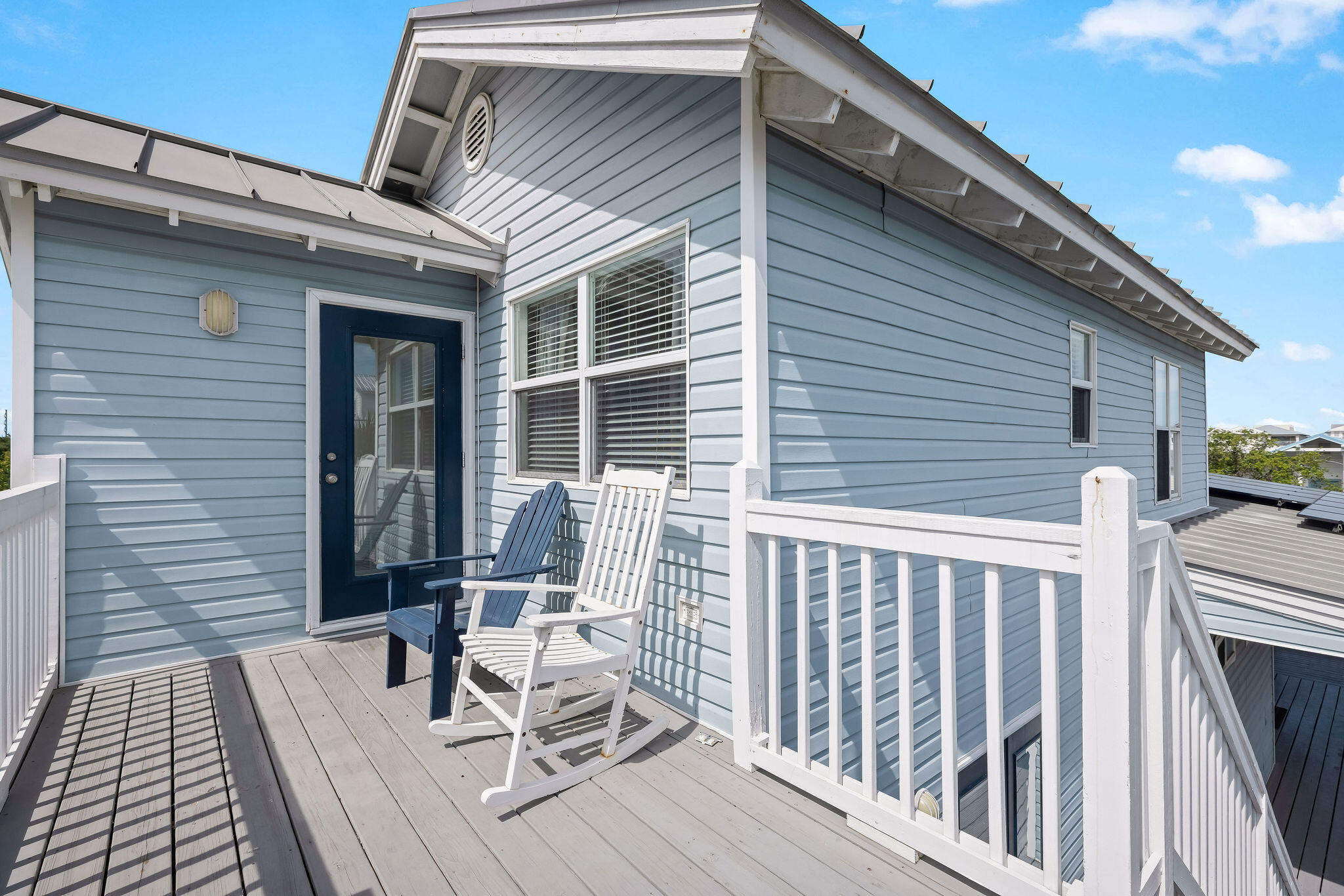 91 Matthew Boulevard Destin, FL 32541 - Photo 63 of 85 a view of deck with a table and chairs and wooden floor