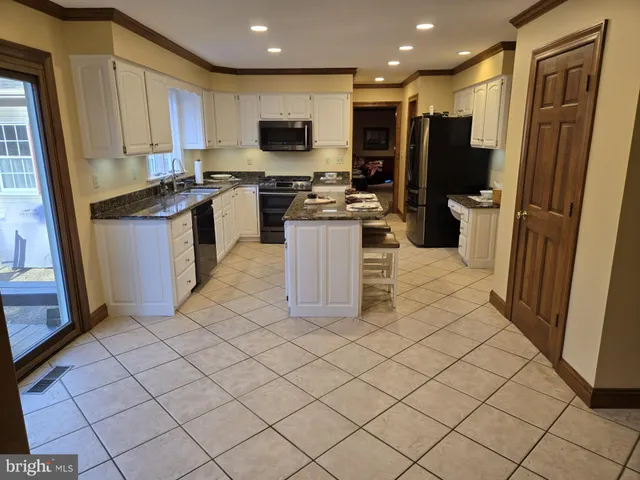 a bedroom with a bed and ceiling fan