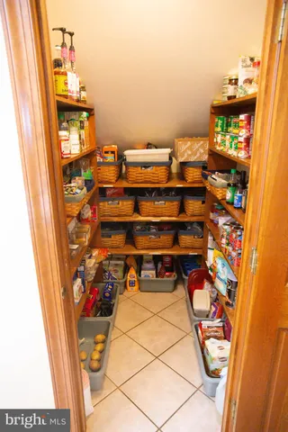 a spacious bathroom with a double vanity sink and a mirror