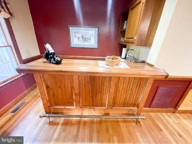 a view of a livingroom with furniture and stairs