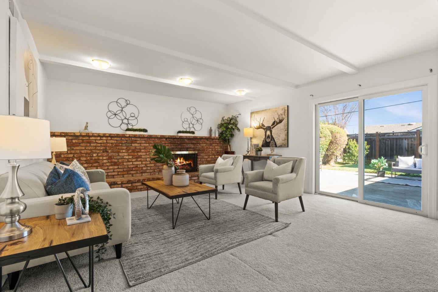 1332 Poe Lane San Jose, CA 95130 - Photo 12 of 32 a living room with furniture and a table