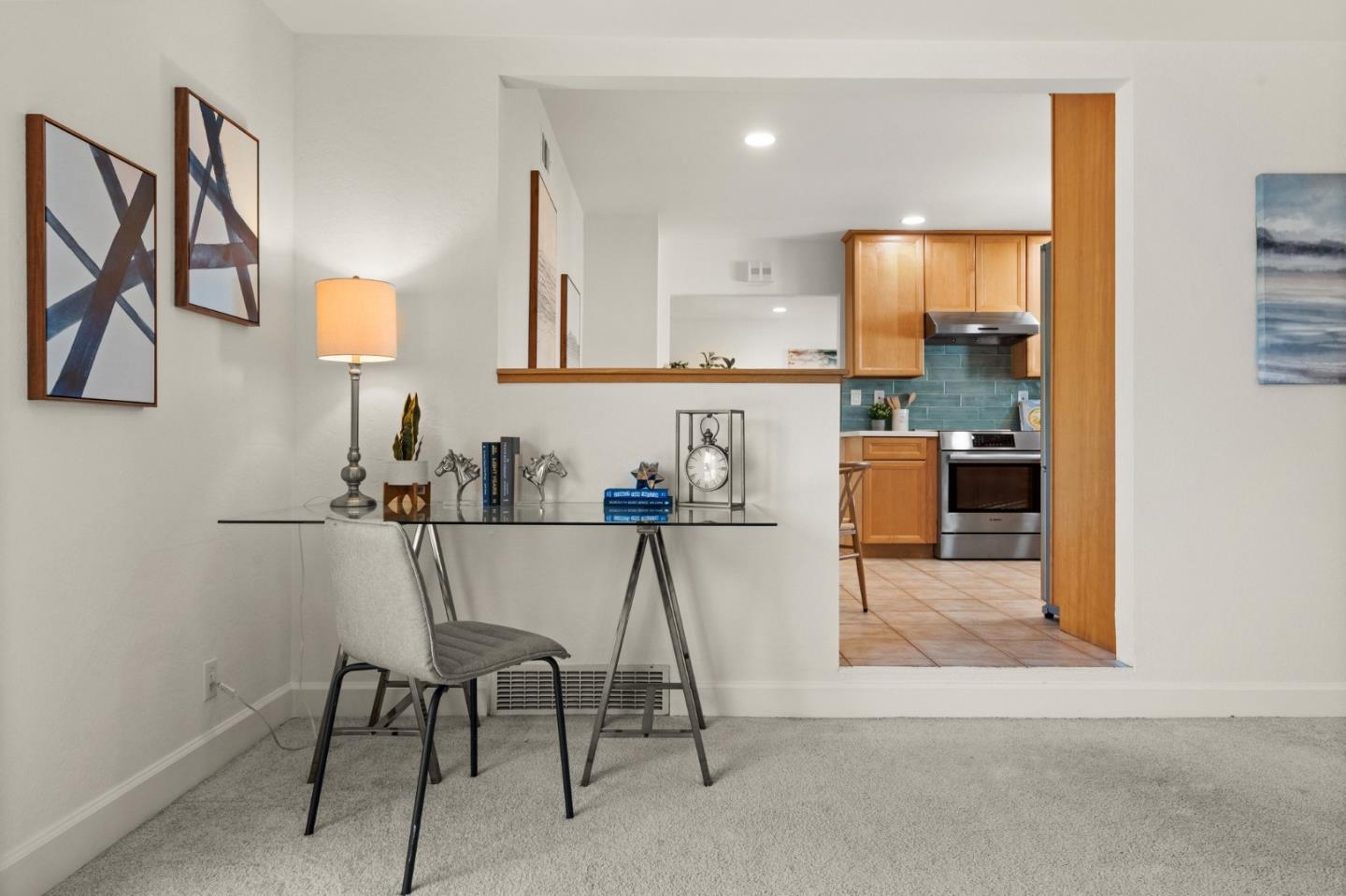1332 Poe Lane San Jose, CA 95130 - Photo 14 of 32 a living room with stainless steel appliances kitchen island granite countertop furniture and a view of kitchen