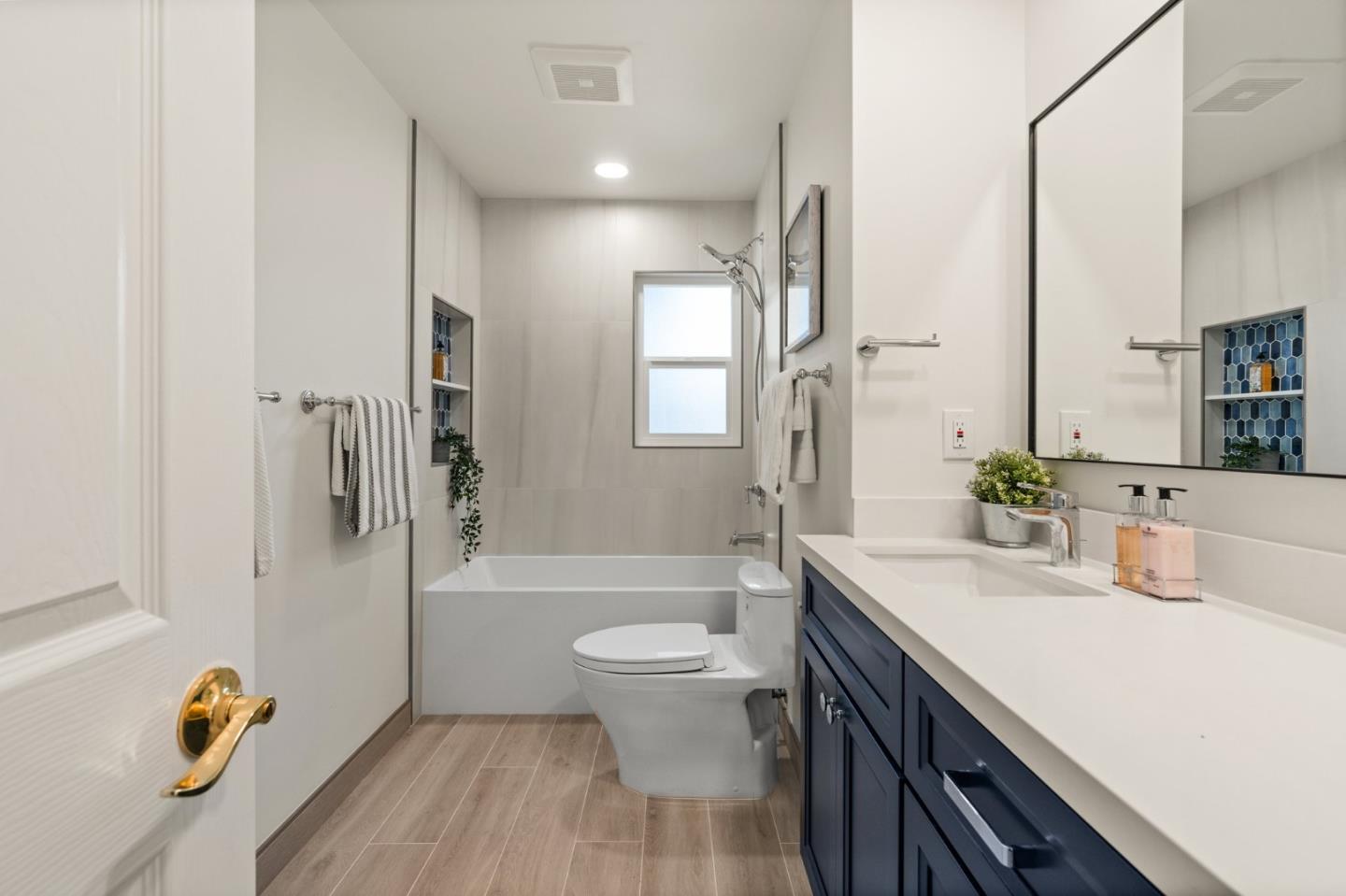 1332 Poe Lane San Jose, CA 95130 - Photo 16 of 32 a bathroom with a sink a toilet and shower