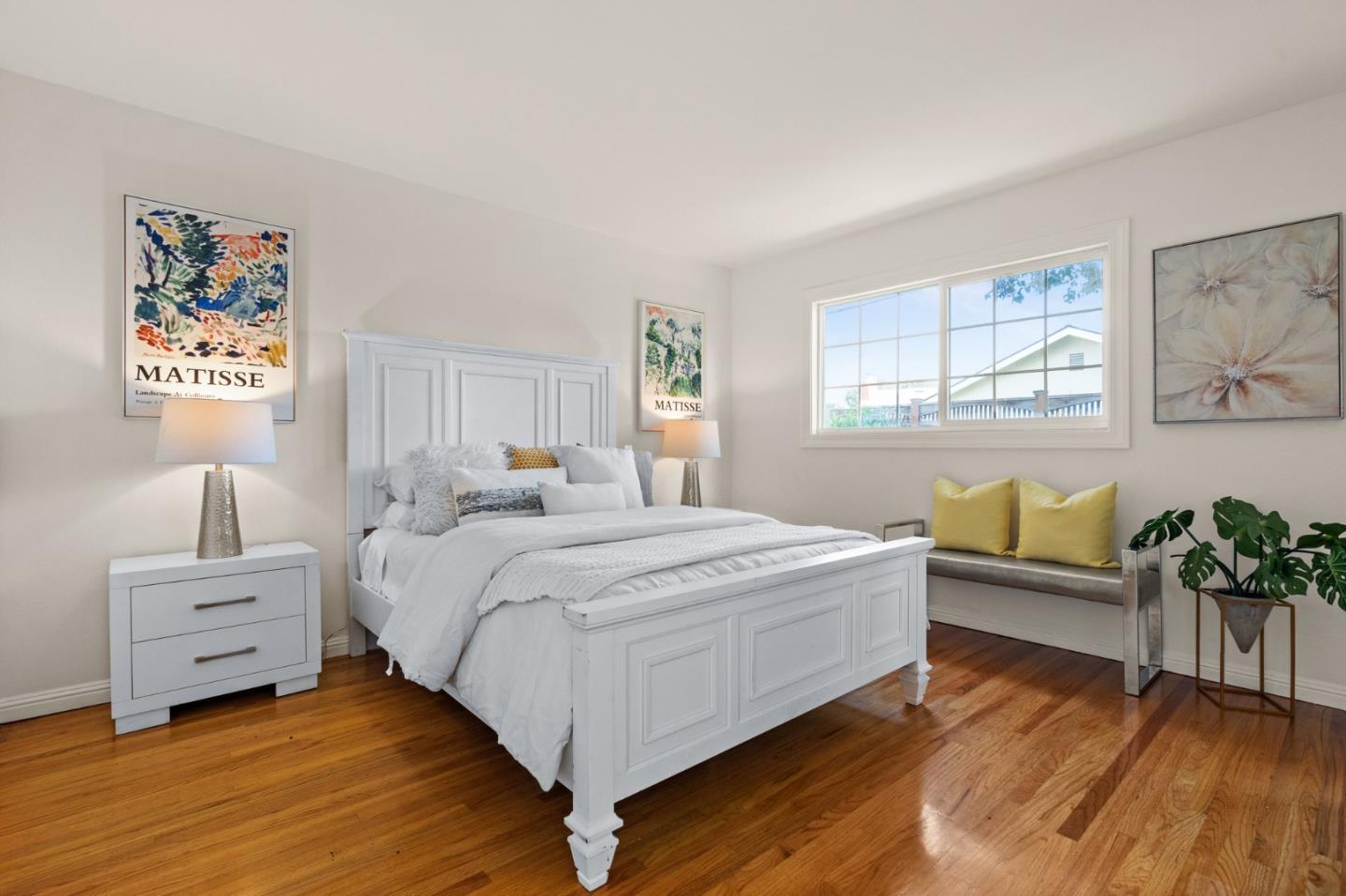 1332 Poe Lane San Jose, CA 95130 - Photo 20 of 32 a spacious bedroom with a bed and a couch