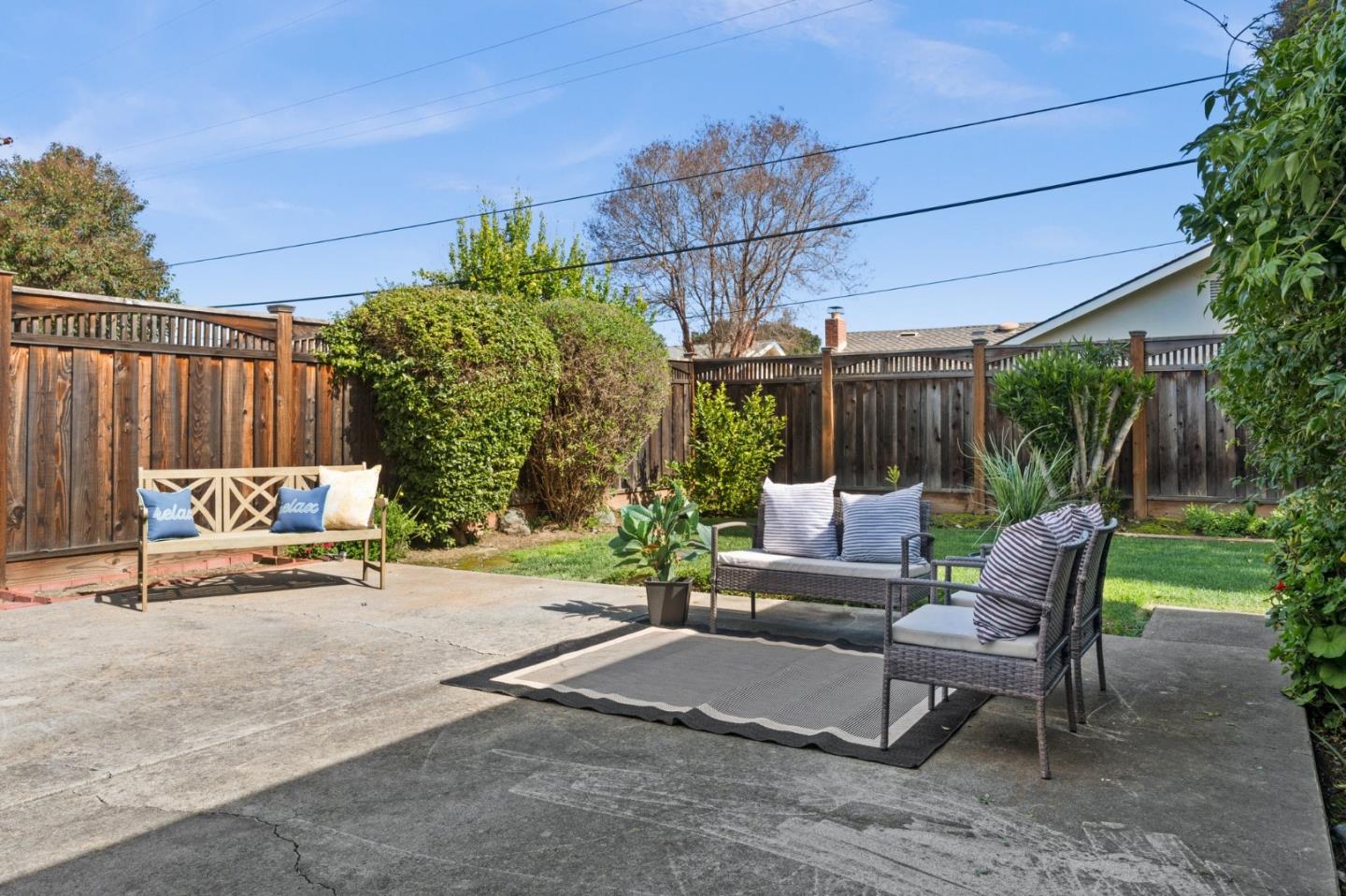 1332 Poe Lane San Jose, CA 95130 - Photo 25 of 32 a view of a patio with a table and chairs and potted plants