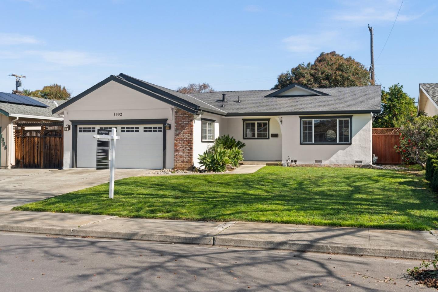 1332 Poe Lane San Jose, CA 95130 - Photo 29 of 32 a front view of a house with a garden and plants