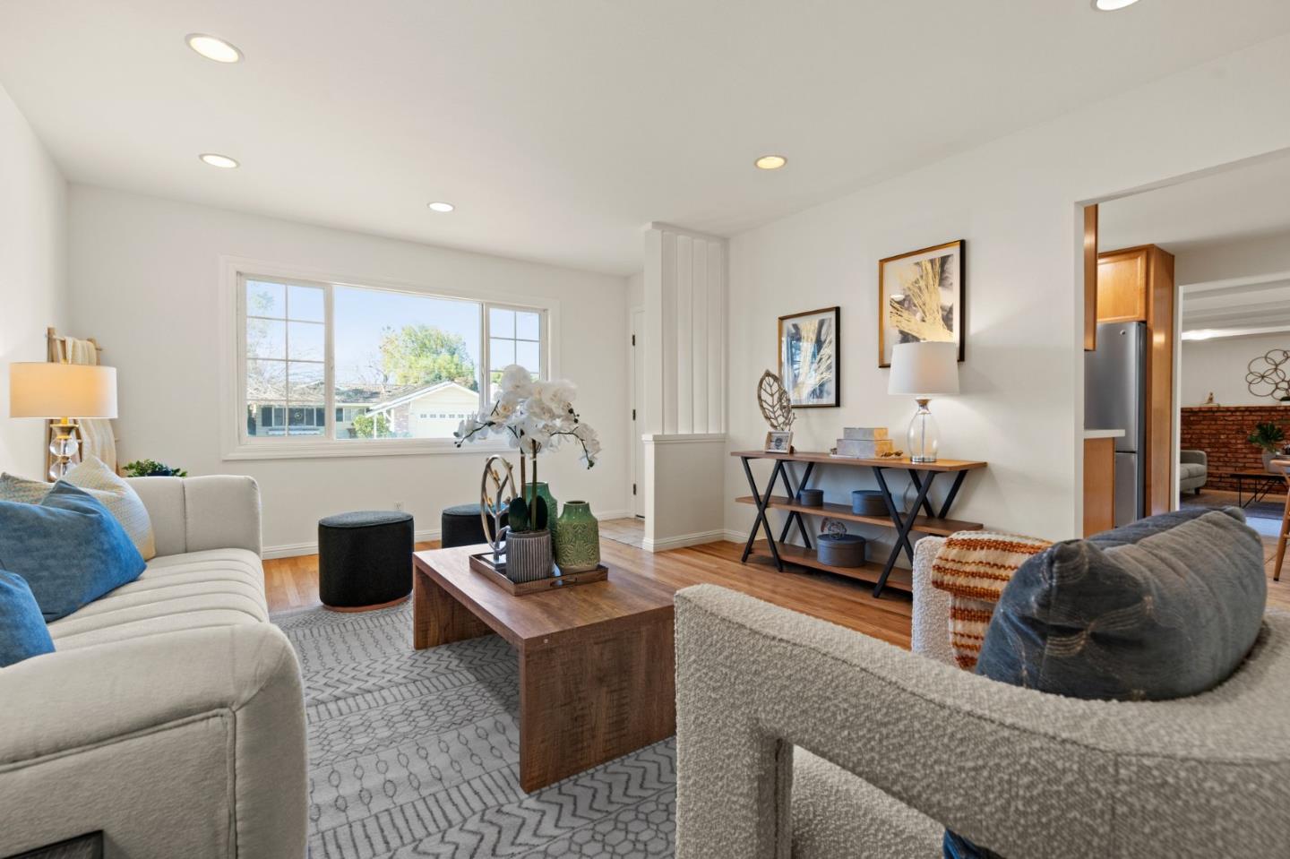 1332 Poe Lane San Jose, CA 95130 - Photo 6 of 32 a living room with furniture and a large window