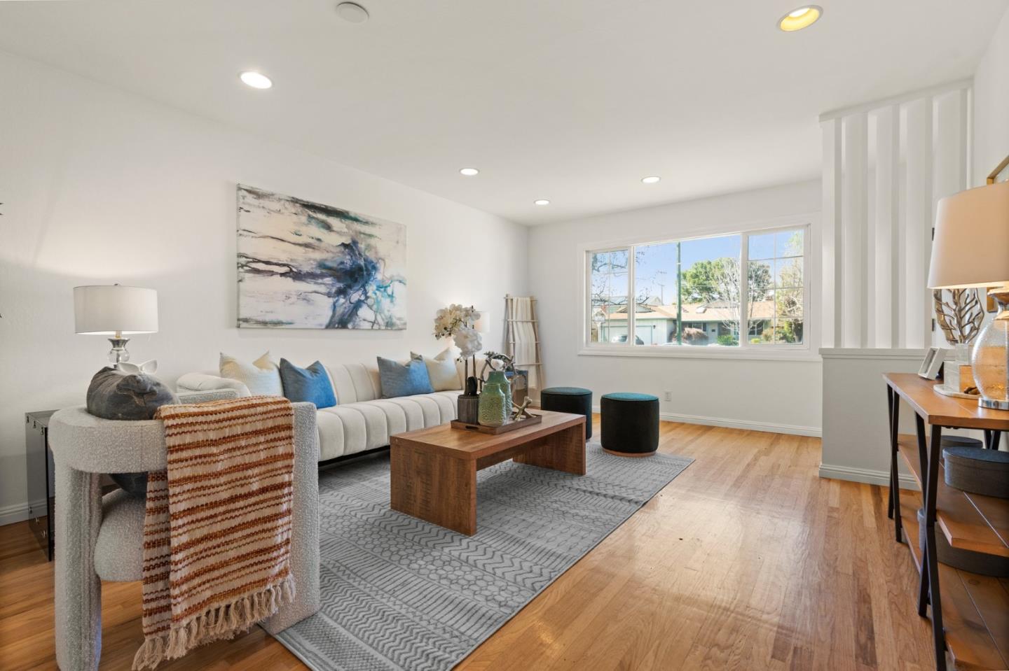 1332 Poe Lane San Jose, CA 95130 - Photo 7 of 32 a living room with furniture and a large window