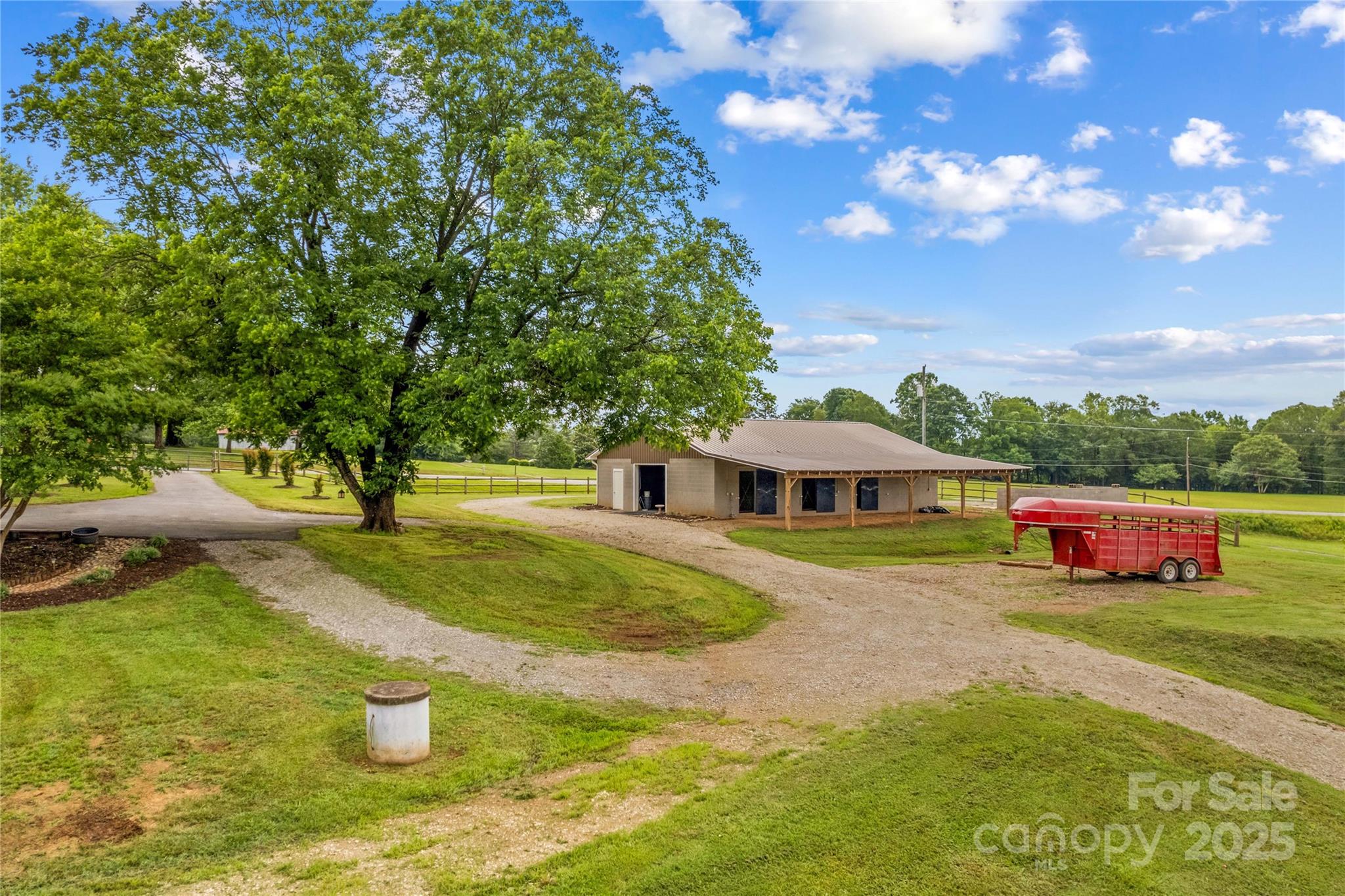 296 Hicks Creek Road Troutman, NC 28166 - Photo 28 of 48 a view of a house with a yard