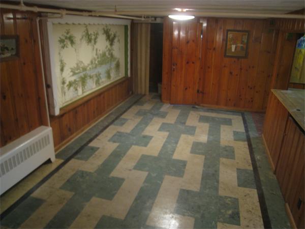 6 Virginia Road Arlington, MA 02476 - Photo 14 of 18 a view of small space with wooden floor and a flat screen tv