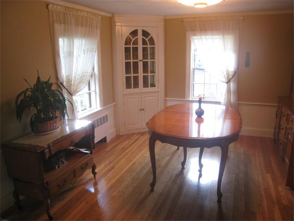 6 Virginia Road Arlington, MA 02476 - Photo 6 of 18 a view of a dining room with furniture and wooden floor