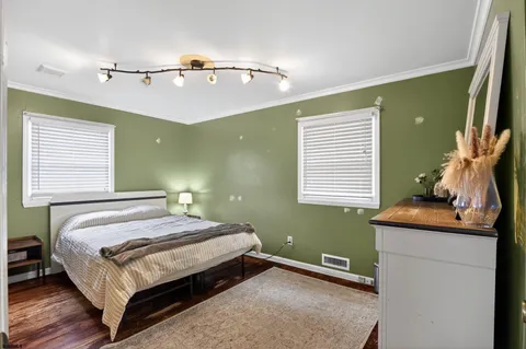 a bedroom with a bed and window