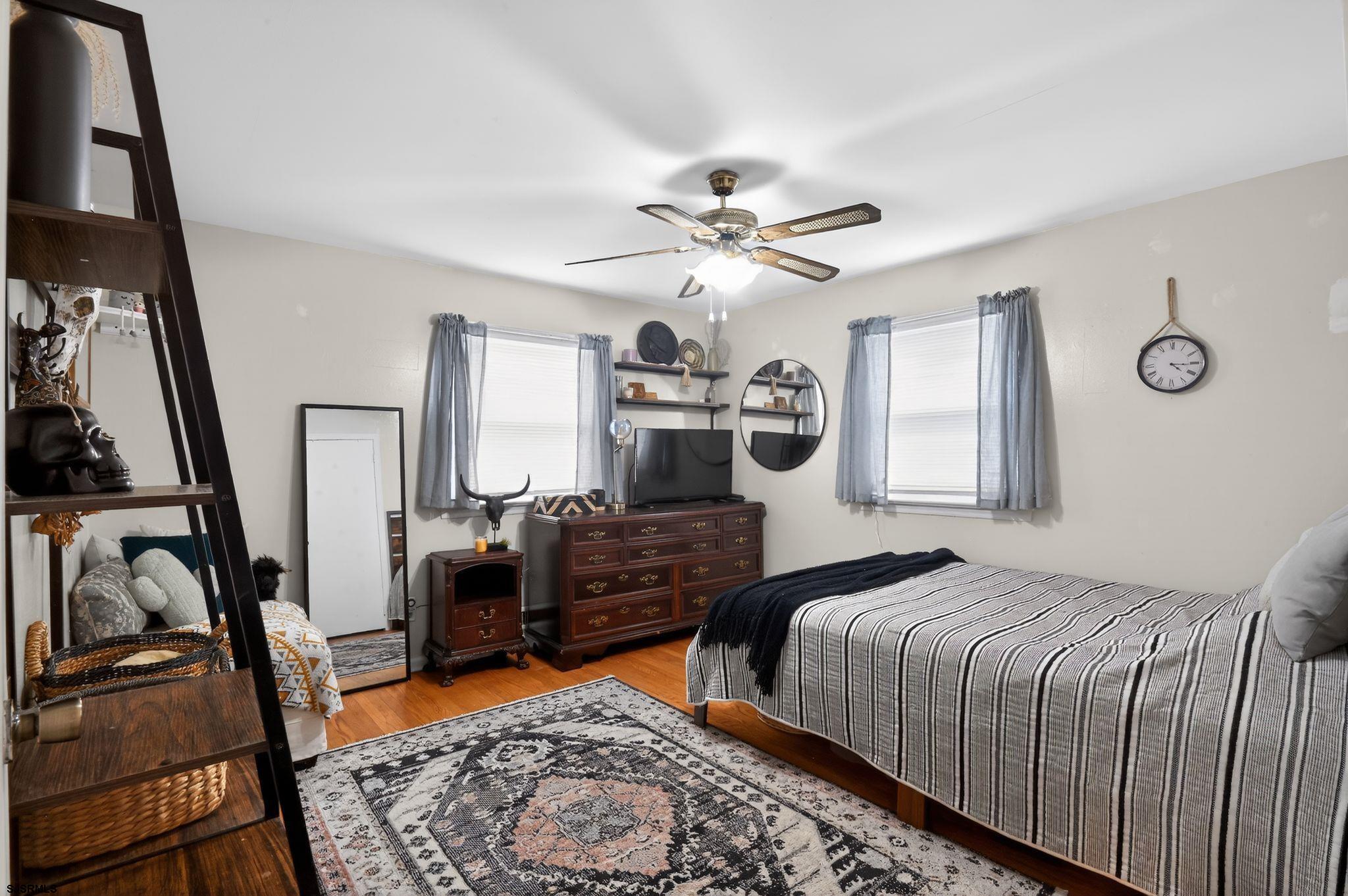 5 Merion Drive Somers Point, NJ 08244 - Photo 20 of 29 a bedroom with a bed a couch and dresser
