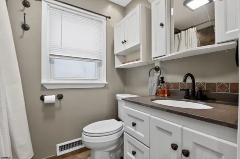a bathroom with a sink and a toilet