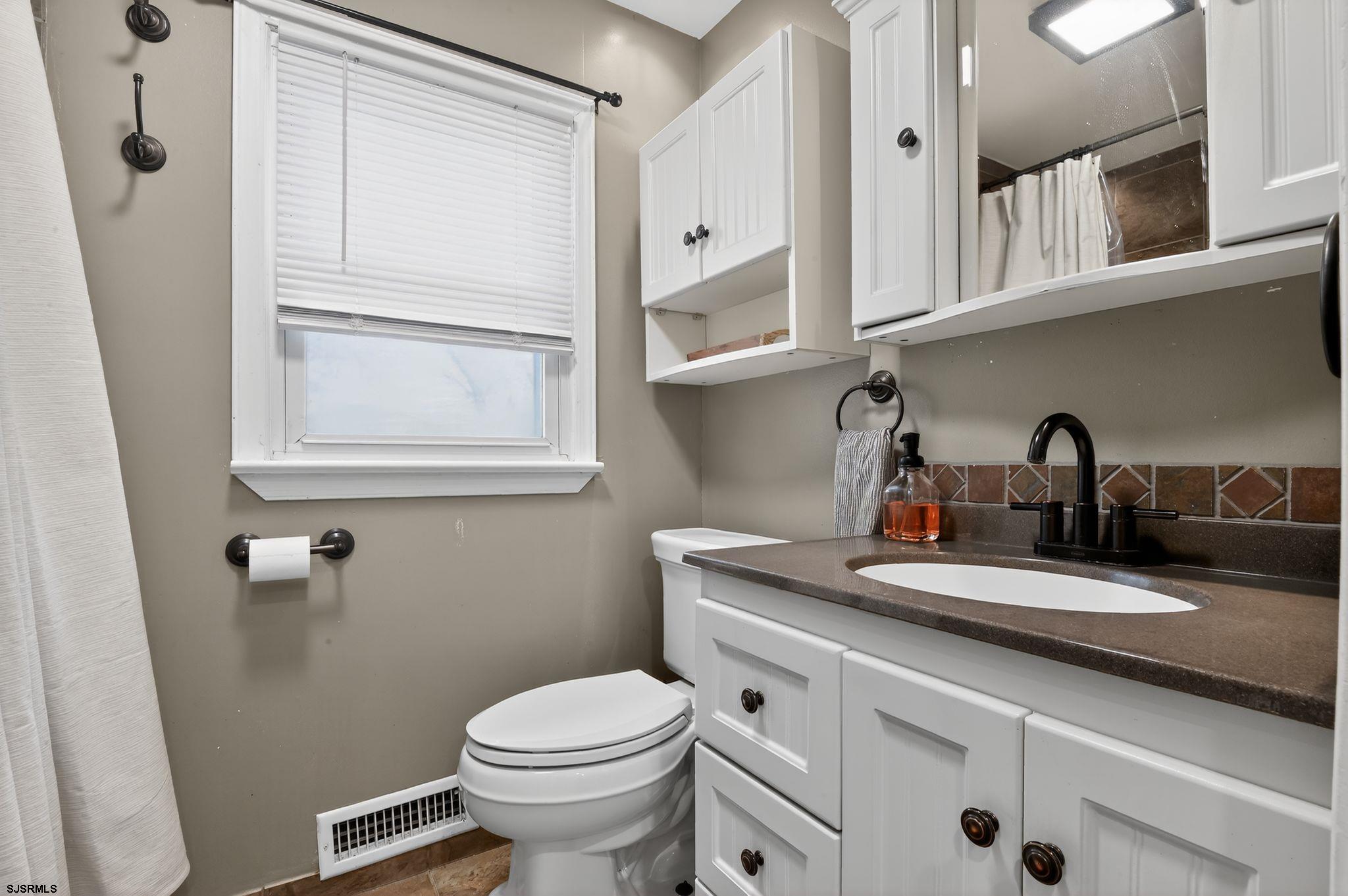 5 Merion Drive Somers Point, NJ 08244 - Photo 22 of 29 a bathroom with a sink and a toilet