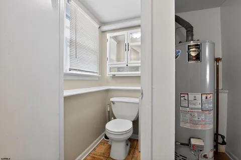a bathroom with a toilet and a sink