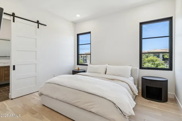 a bedroom with a bed and a fireplace