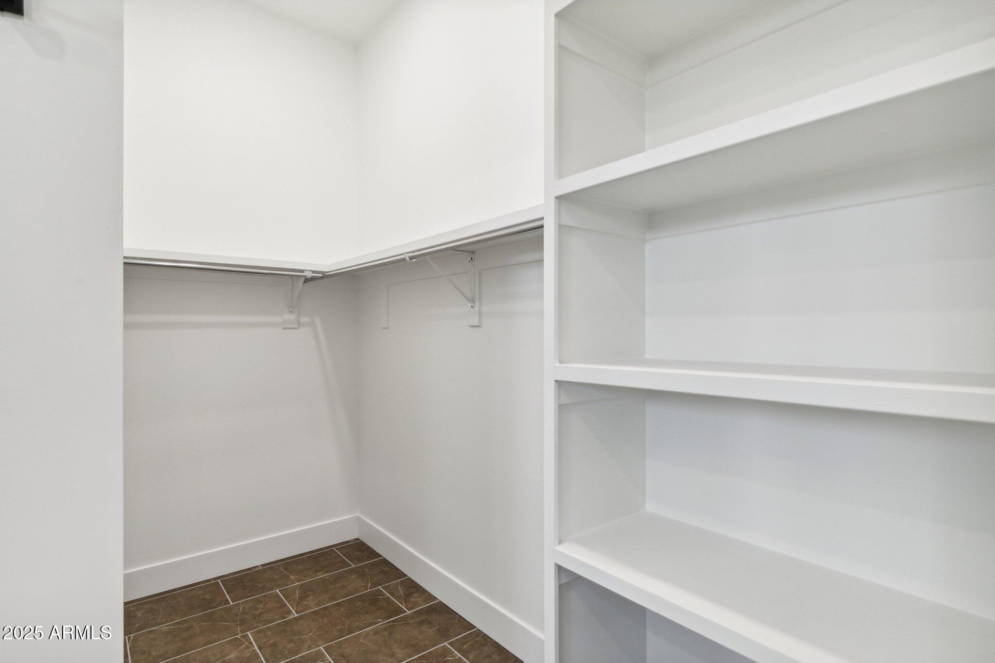 1501 North Miller Road, Unit 1016 Scottsdale, AZ 85257 - Photo 13 of 23 a view of an empty walk in closet