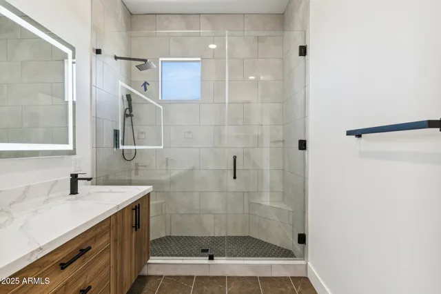 a bathroom with a shower and a sink