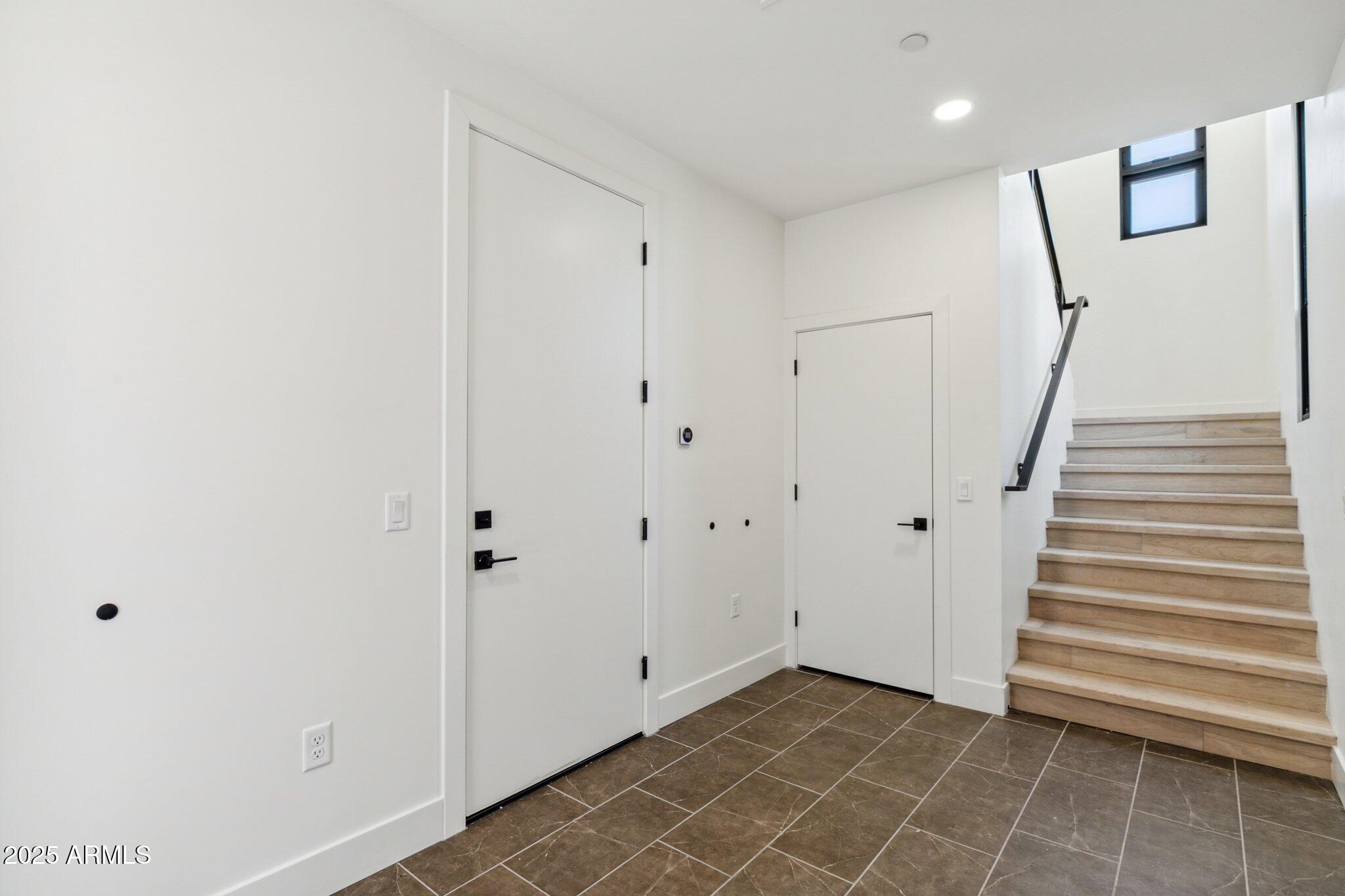 1501 North Miller Road, Unit 1016 Scottsdale, AZ 85257 - Photo 2 of 23 a view of a hallway with staircase
