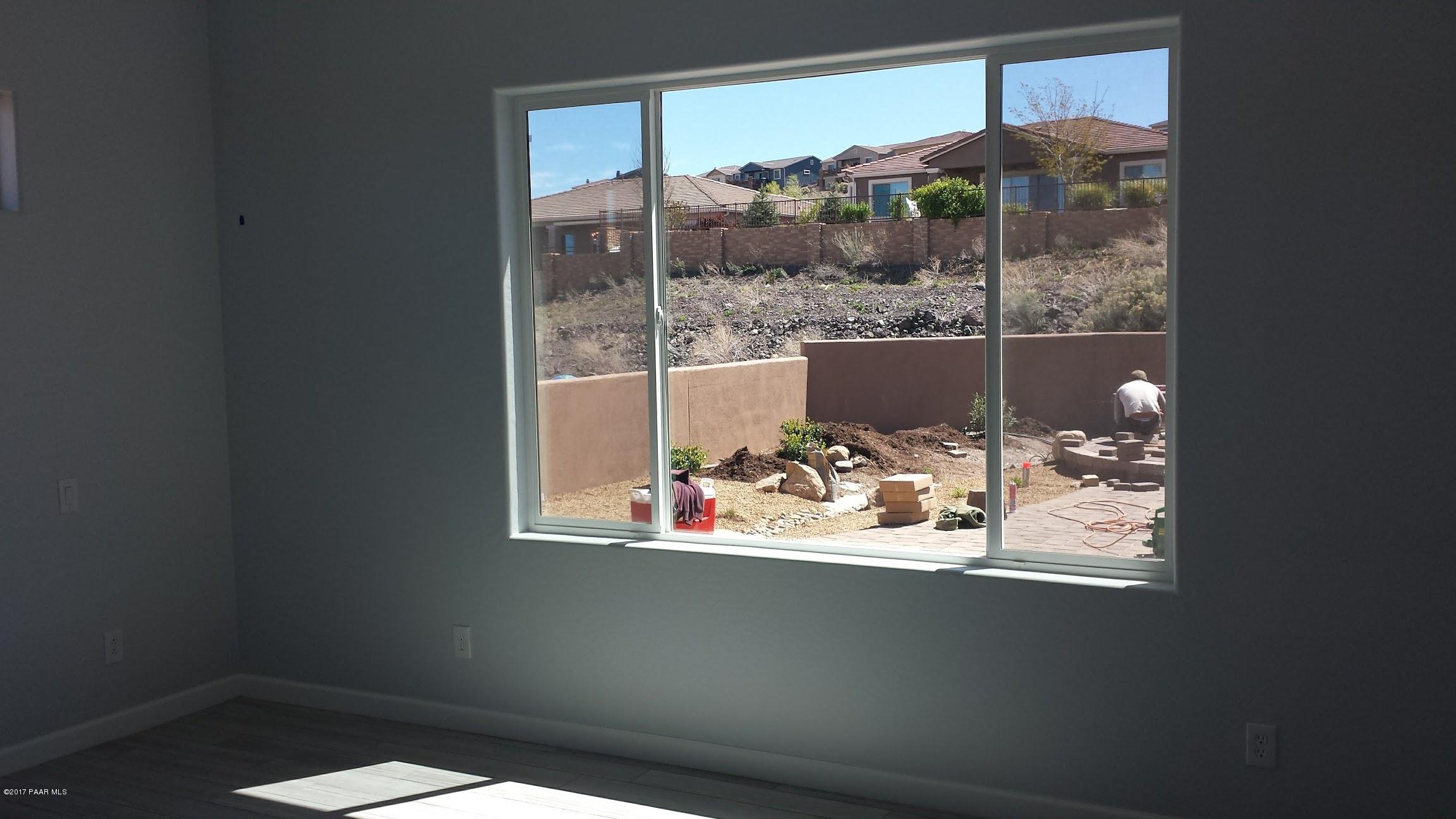1723 Ascott Street Prescott, AZ 86301 - Photo 3 of 12 a view of a glass door with a bench in it