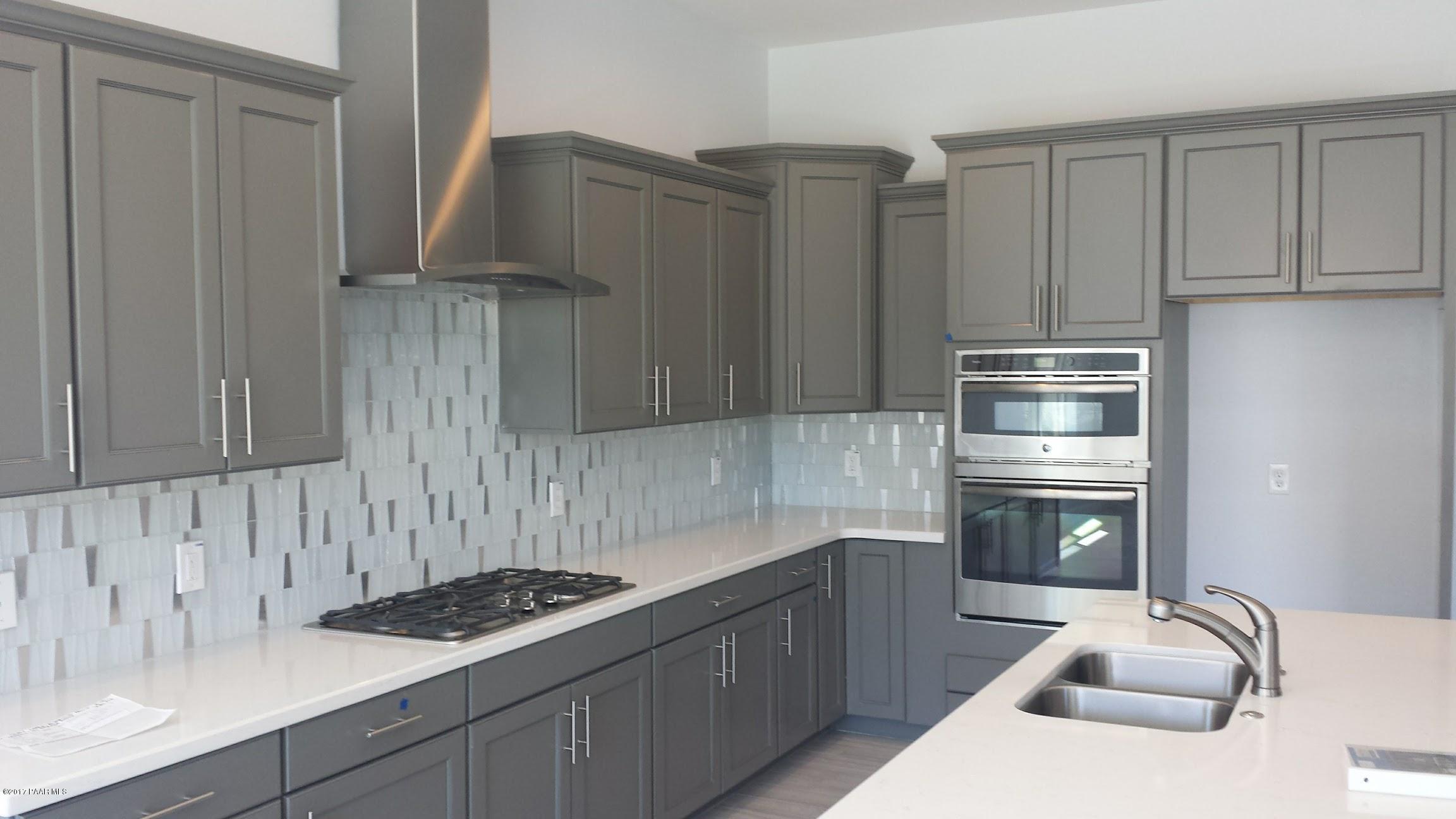 1723 Ascott Street Prescott, AZ 86301 - Photo 4 of 12 a kitchen with granite countertop a sink stove and refrigerator